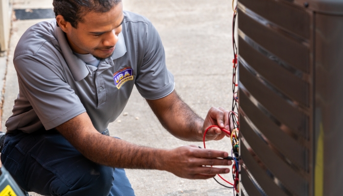 Technician Working On Hvac Condensor